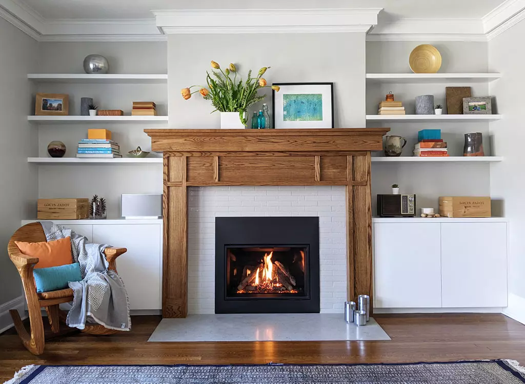 Transitional arts crafts oak fireplace surround gas insert white built in cabinets floating shelves storage