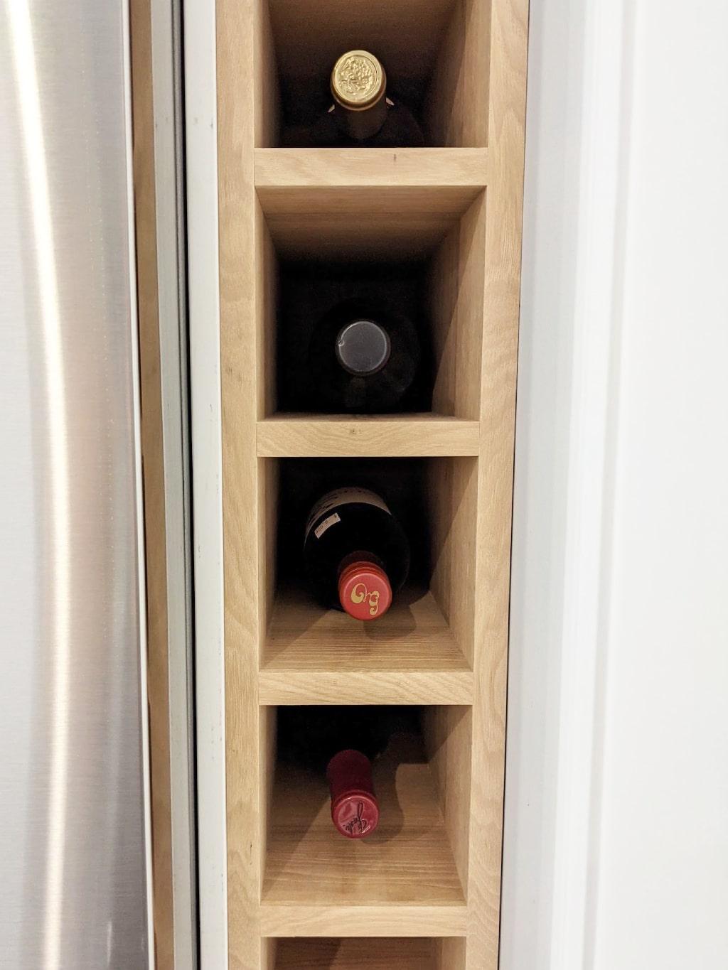 Kitchen design idea use fridge gap for slim tall hickory wood wine rack