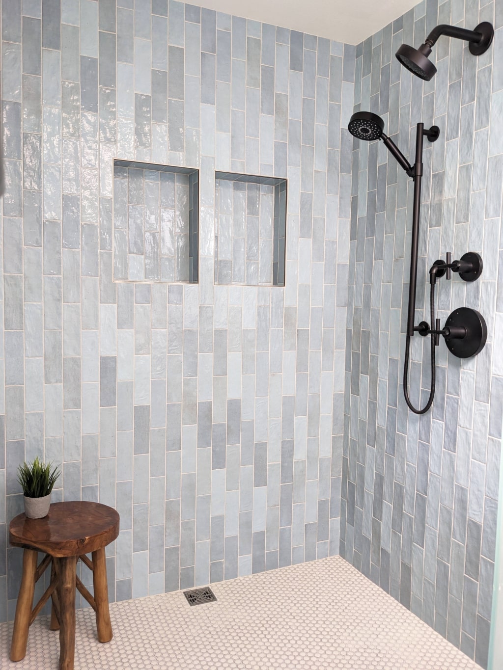 Aging in place home design frameless shower with penny tile