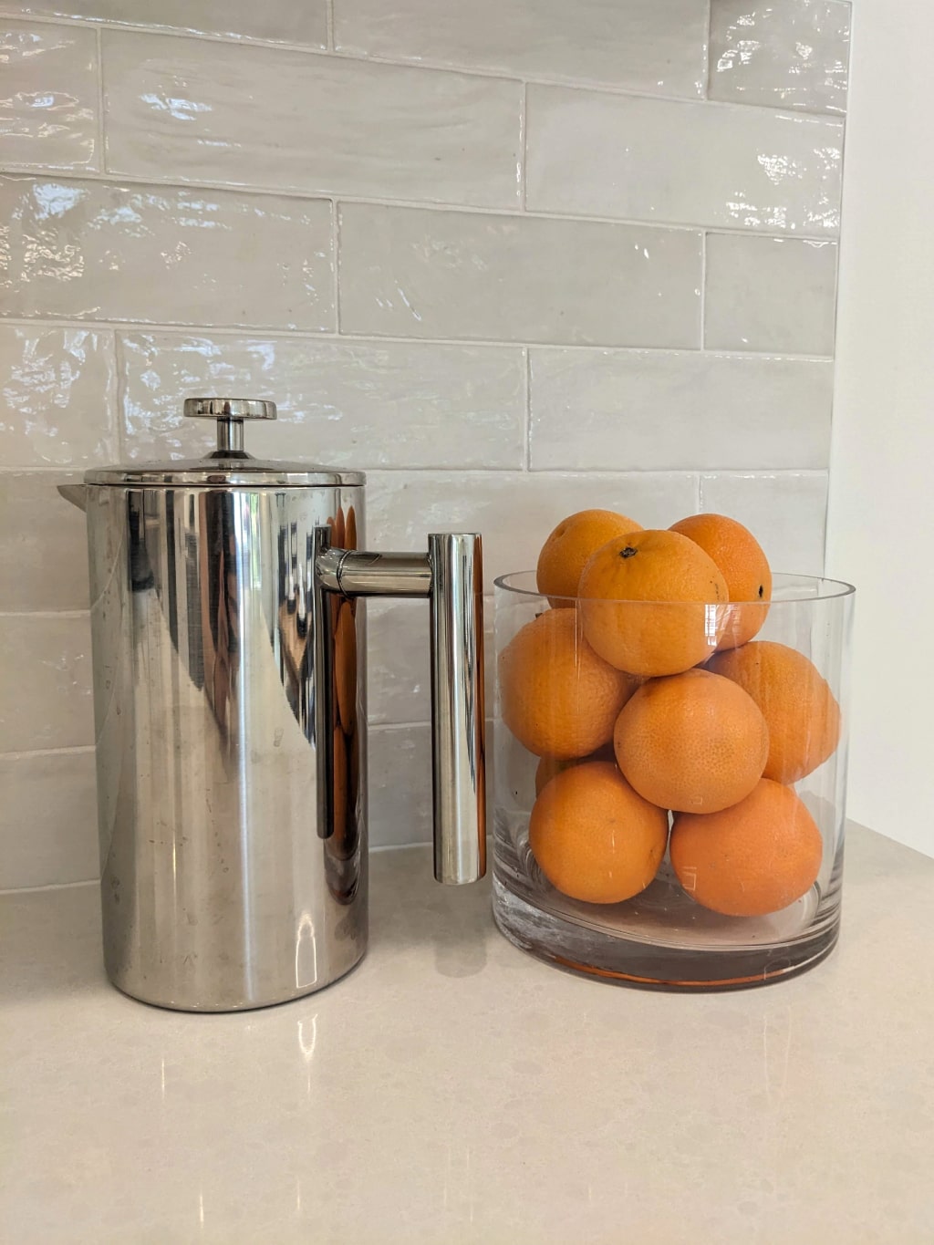 Farmhouse kitchen décor against a white tile backsplash